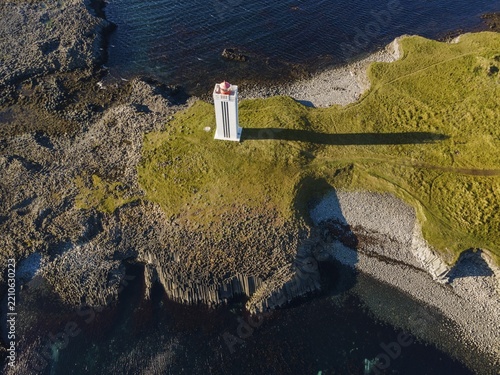 Lighthouse and coastal landscape with basalt formations, Kálfshamarsvík, Skagi Peninsula, Iceland