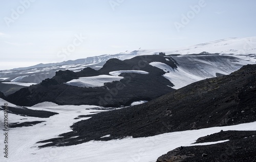 Landscape at the hiking trail Fimmvörðuháls, barren volcanic landscape with snow, Þórsmörk Nature Reserve, Suðurland, Iceland