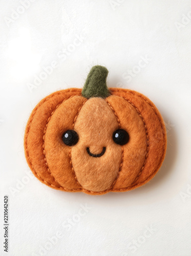 Cute Handmade Felt Pumpkin with Smiling Face on White Background