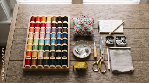 Sewing Kit Flat Lay with Thread Spools and Tailoring Tools