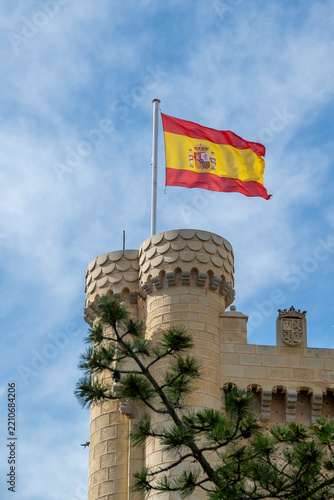 Spanish flag flying above castle tower