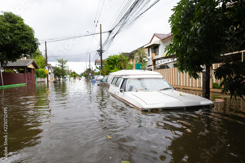 Cars submerged in water. Street after heavy rain. Disaster Motor Vehicle Insurance Claim, Severe weather