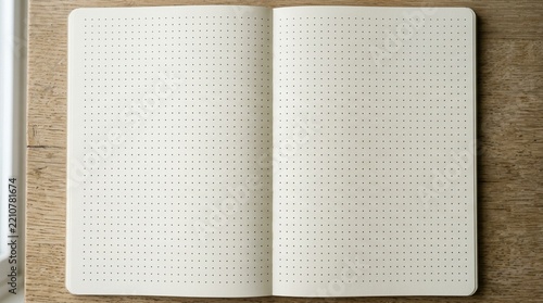 Blank Dot Grid Notebook Open on Wooden Desk - Top View