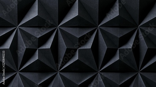 Close-up of a black background with a geometric pattern of multiple triangular shapes. the shapes are arranged in a repeating pattern, creating a sense of depth and dimension.