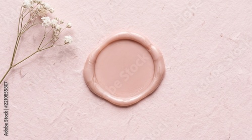Overhead blush wax shape on handmade paper