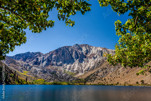 Convict Lake through trees on the shore in the Sierra Nevada mountains of California