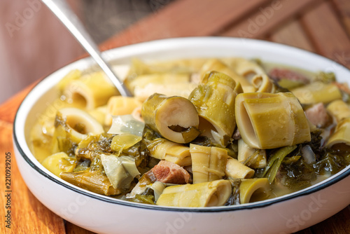 traditional Chinese home cooked food pickled sour mustard bitter bamboo shoot stewed pork belly cuisine