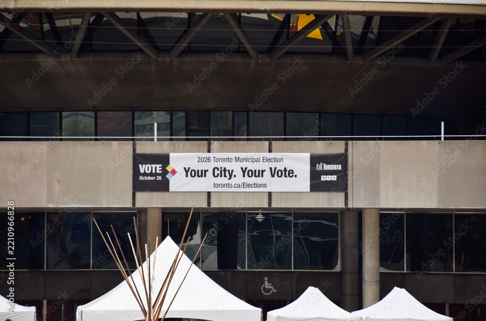 Fototapeta premium 2026 Toronto Municipal Election banner hanging on the concrete facade of City Hall