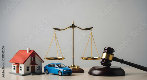 Legal Justice Concept Featuring Scales of Justice with Model House and Car and Wooden Gavel for Courtroom Litigation and Settlement Disputes