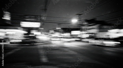 Motion blur of city street lights at night in black and white