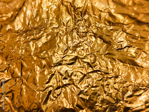 Glossy Gold-Textured Paper Background with Abstract
Shadow Lines