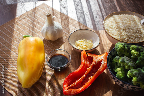 Raw Cooking Ingredients with Rice, Broccoli, Peppers, Garlic and Soy Sauce