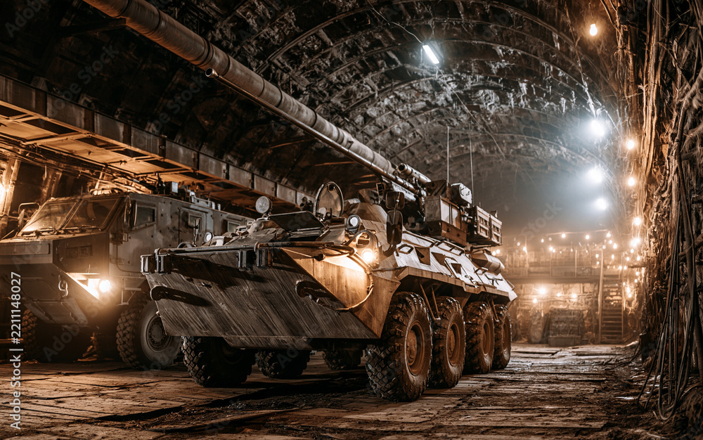 Obraz premium Military defense and combat readiness, heavy artillery and armored vehicle in a dark underground bunker for strategic warfare and national security