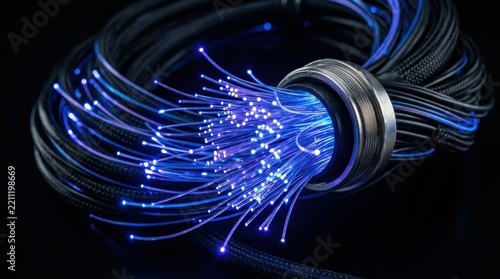 Coiled fiber optic cables glowing with blue light against a dark background