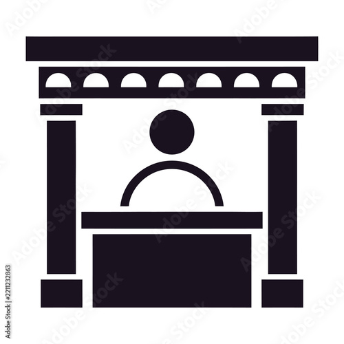 Person speaking at a podium with columns