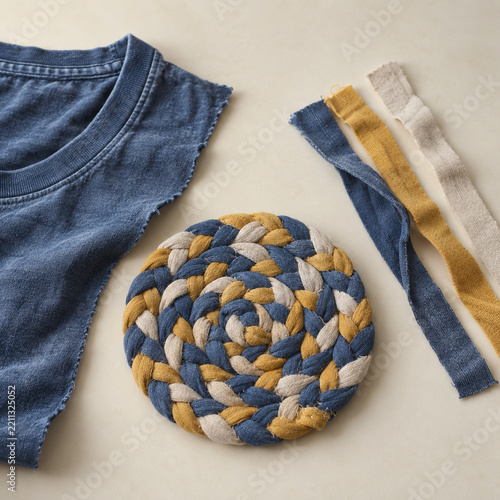 Braided fabric coaster beside cotton shirt remnant and strips