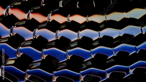 Waving grid of metallic blue and gold hexagons