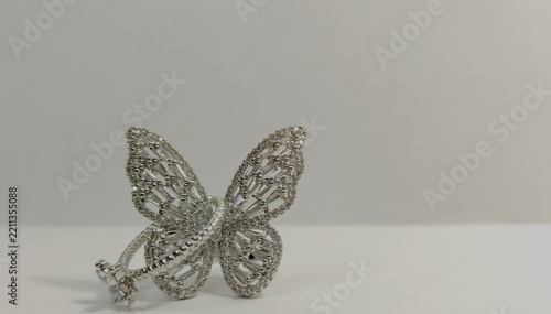 Obraz na plátně Delicate silver butterfly brooch decorated with sparkling rhinestones