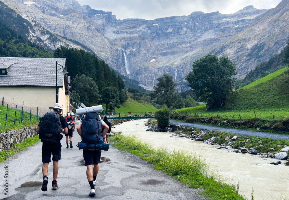 Obraz premium Hiking trail to Gavarnie Falls, spectacular waterfall in french Pyrenees, highest waterfalls in France, popular tourist landmark