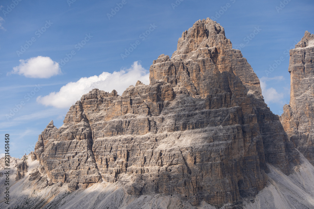 Obraz premium Mountain landscape panorama Tre Cime Mount against a blue summer background. 