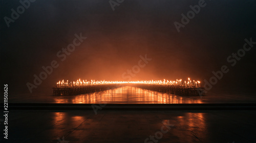 Rows of Burning Candles Glowing in Dark Atmospheric Hall