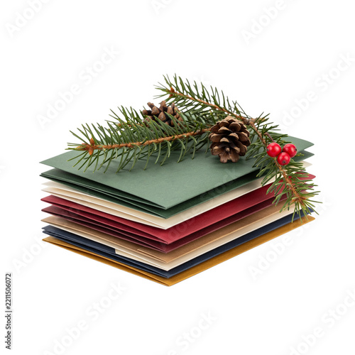 Stack of colorful envelopes with pine branches isolated on a transparent background
