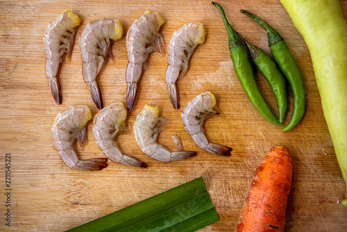 fresh prawns on wooden background
