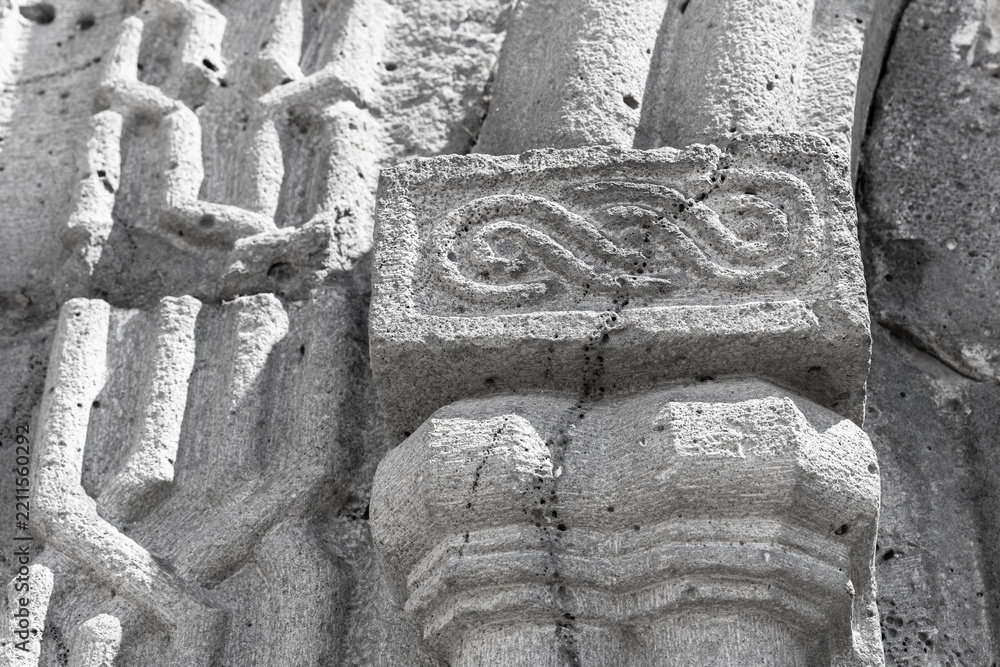 Obraz premium Close-up of a weathered stone carving showing ornamental relief and textured masonry of medieval Haghpat Monastery built between the 10th and 13th century also known as Haghpatavank, Armenia