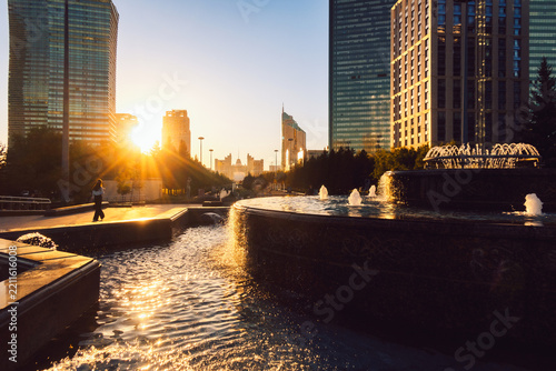 Nurzhol Boulevard in Astana, featuring flowering landscape, wide pedestrian pathway, contemporary architecture and illuminated skyline, Astana, Kazakhstan