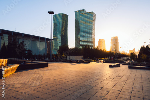 Nurzhol Boulevard in Astana, featuring flowering landscape, wide pedestrian pathway, contemporary architecture and illuminated skyline, Astana, Kazakhstan