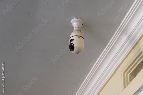 Ceiling-mounted smart bulb-style CCTV camera for home security monitoring. Wireless IP security camera with a light bulb design.