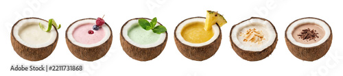 Collection of six colorful tropical smoothies served in natural coconut shells with various fruit and herb garnishes, showcasing a healthy and delicious assortment of summer drinks