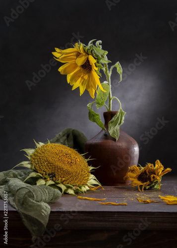 Still life with sunflowers against a dark background