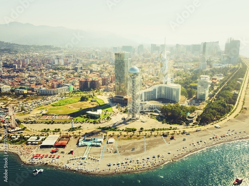 Aerial view Batumi Georgia with Alphabetic Tower seaside skyline Black Sea coast modern architecture beach promenade in hot summer day