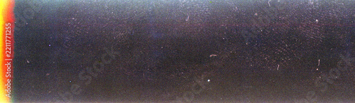 Blank grained film strip texture background with heavy grain, dust and light leak