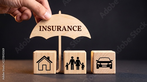 Insurance protection concept with wooden blocks covering family, house and car icon