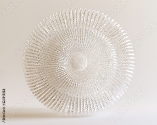 White, intricately woven basket-like object against a neutral backdrop.