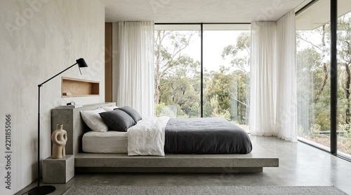 Modern bedroom with large windows overlooking forest, minimalist design