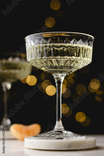 Elegant champagne glass with festive bokeh background
