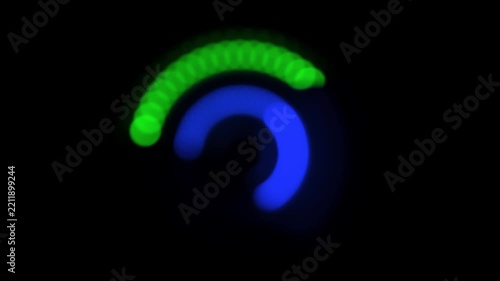 Defocused spinning LED wheel, red green blue light circles on black
