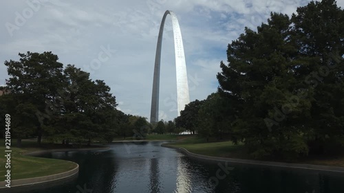 Gateway Arch in St. Louis. A drone moves toward the arch across the South Pond.