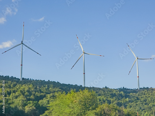 Fotografie Wind Turbines Generating Clean Renewable Energy on Mountain Hills