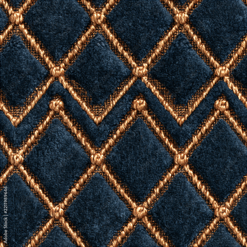 Fototapeta premium Seamless pattern blue velvet fabric creating a quilted diamond pattern, featuring golden decorative stitching. Rich texture and elegant design