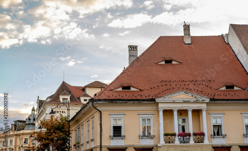 Historical building with white columns and unique roof windows known as the 