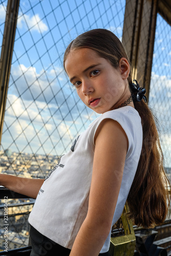 Young girl stands at a high observation deck