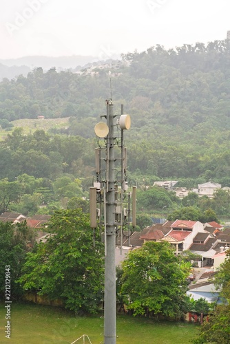Top of a tall mast with mobile cellular antennas.