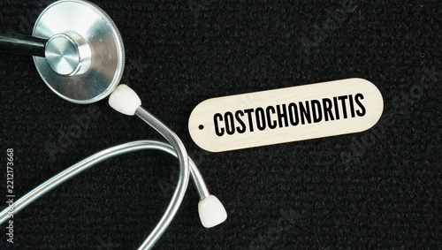 Stethoscope and paper with the words Costochondritis is the inflammation of the cartilage that connects your upper ribs to your breastbone
