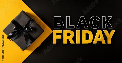 Premium Black Friday promotional composition with a black gift box and bold black and gold typography on a dramatic background, designed for seasonal retail advertising, shopping and special offers.