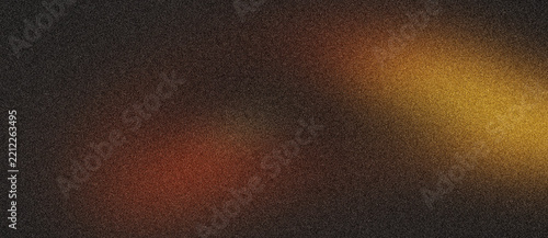 Warm orange and yellow light highlights on a dark grainy noise texture background backdrop.