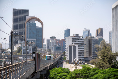 A daytime view of Addis Ababa skyline featuring modern high rise architecture with the elevated light rail tracks.